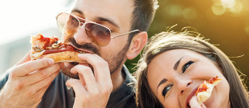 Couple Enjoying great pizza in Brampton